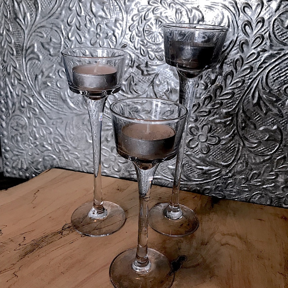 Set of three glass votive candle holders, different sizes